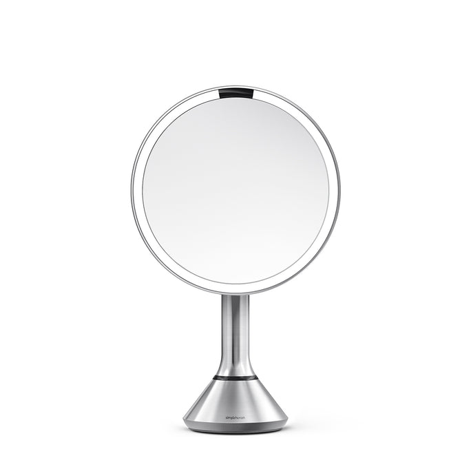 Simplehuman Sensor Mirror Round, Brushed Stainless Steel. Side view showing the adjustable pivot and tilt.