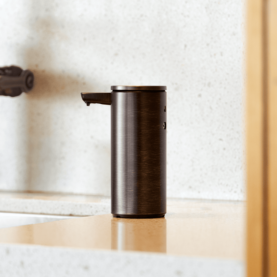 Profile view of Simplehuman 9 oz. Rechargeable Sensor Pump in Dark Bronze, hands-free dispenser with adjustable dosage.