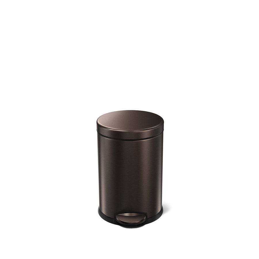 Angled view of Simplehuman 4.5L Round Step Can in Dark Bronze finish, compact size with hands-free pedal.