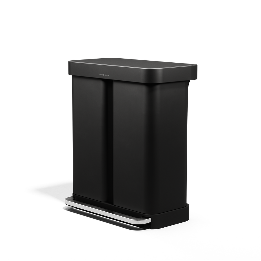 Angled view of Simplehuman 58L Step Recycler, Matte Black, dual compartment for recycling, hands-free pedal.