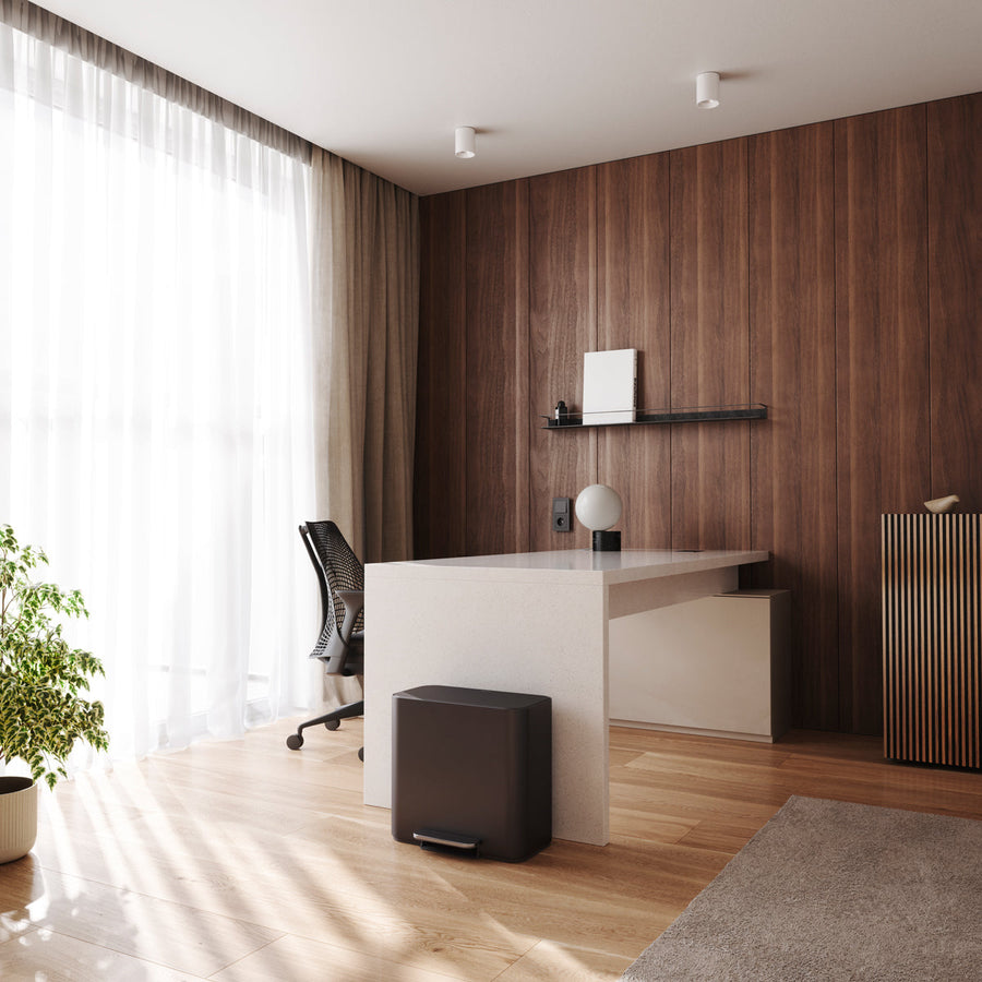 Simplehuman Matte Black 15L Mini Recycler Step Can integrating into a contemporary home office, featuring hands-free operation.