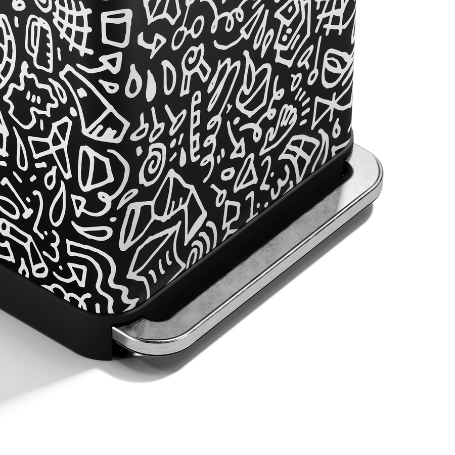 Close-up of Simplehuman 55L Rectangular Step Can black graphic print and durable hands-free pedal.