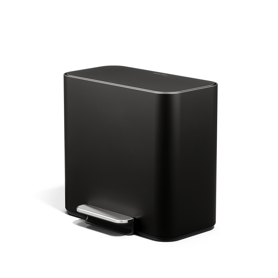 Simplehuman 16L Matte Black Mini Step Can with pedal, angled view.