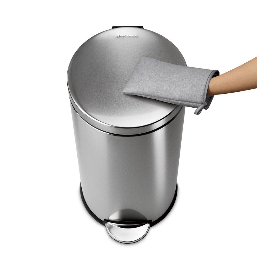 Top-down view of Simplehuman Microfiber Mitt cleaning a brushed stainless steel can, gentle, streak-free surface care.