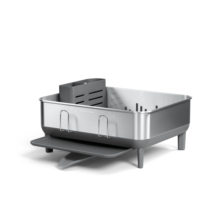 Angled view of Simplehuman Compact Steel Frame Dishrack, Brushed Stainless Steel, featuring utensil caddy and direct drainage.