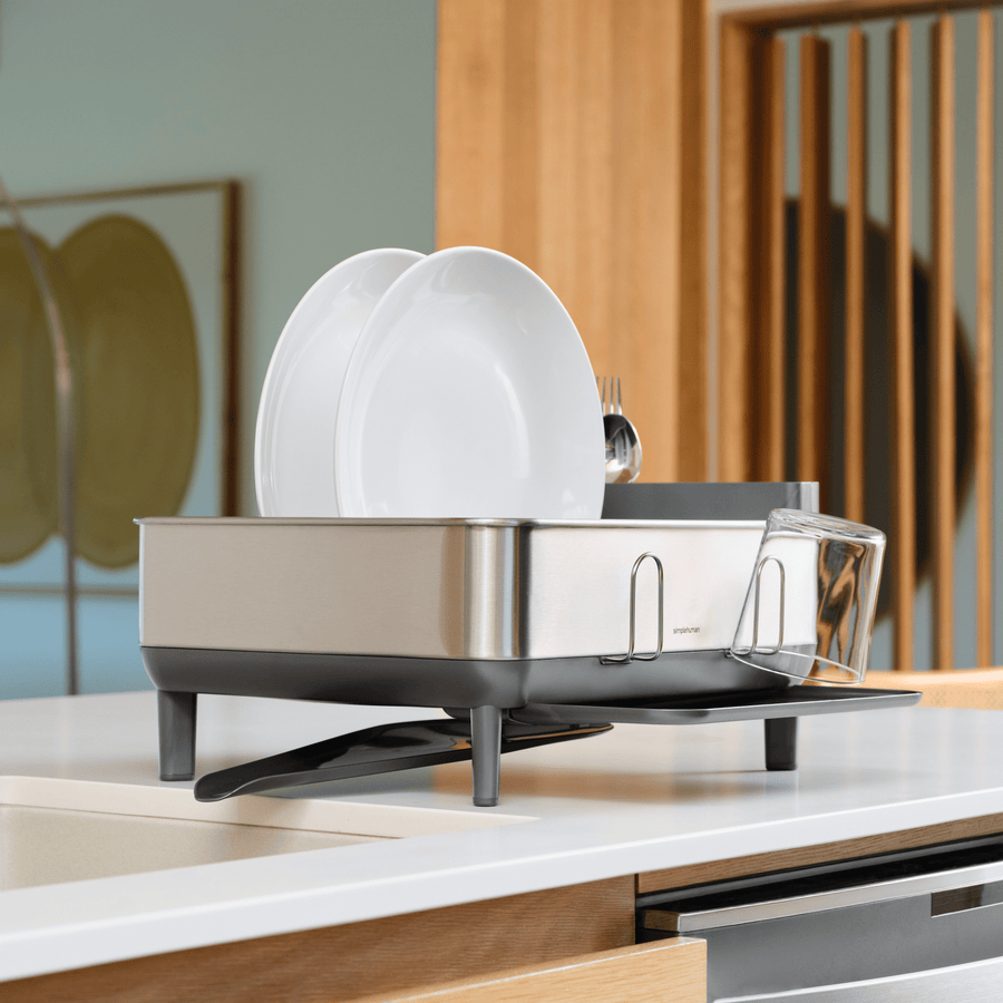 Simplehuman Compact Steel Frame Dishrack, side view showing exterior glass rack and adjustable drainage spout.