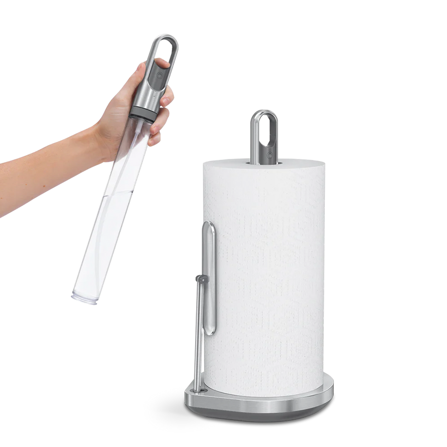 Simplehuman Brushed Stainless Steel Paper Towel Holder, showing hand removing the clear spray bottle handle.