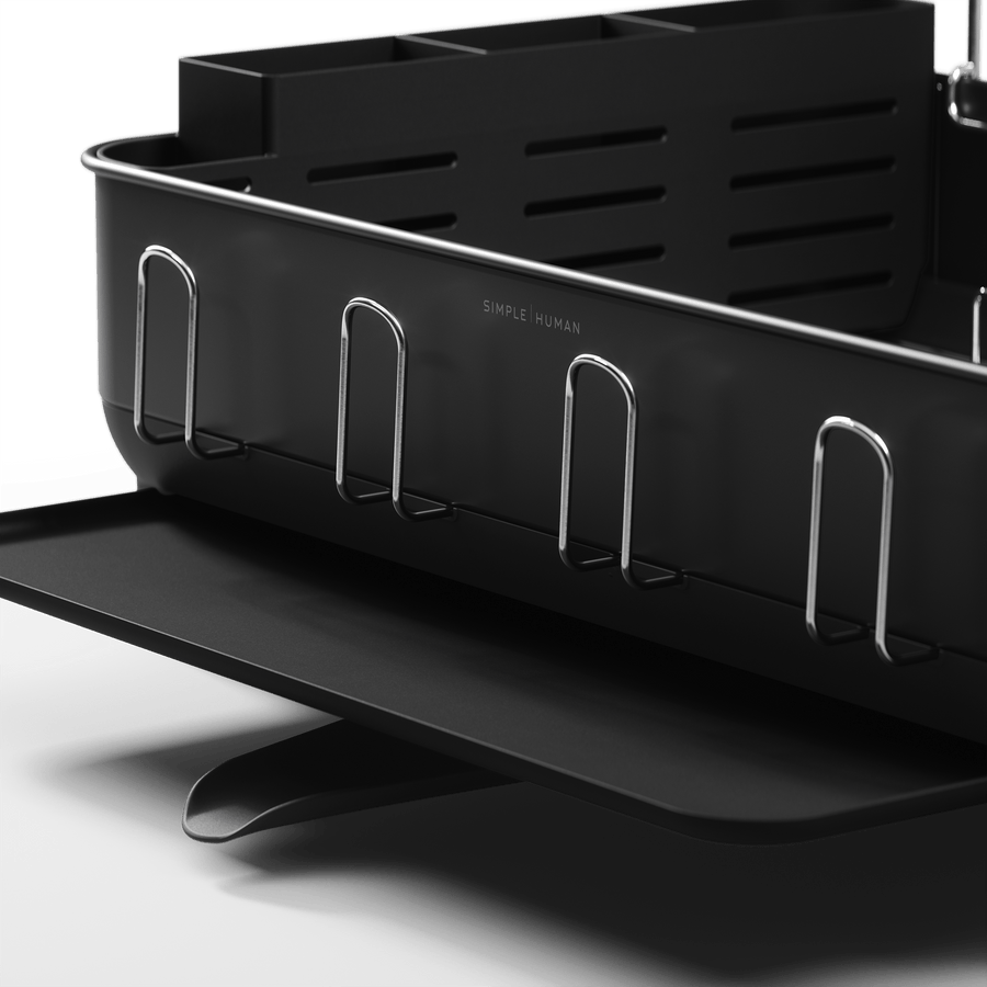 Detail view of Simplehuman Matte Black Steel Frame Dishrack showing integrated cup hooks and pivoting drain spout.