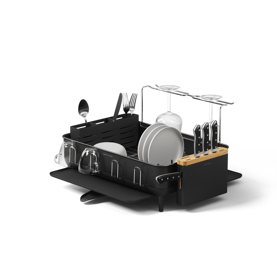 Studio view of Simplehuman Matte Black Dishrack, displaying modular wine glass rack, removable knife block, and utensil caddy.