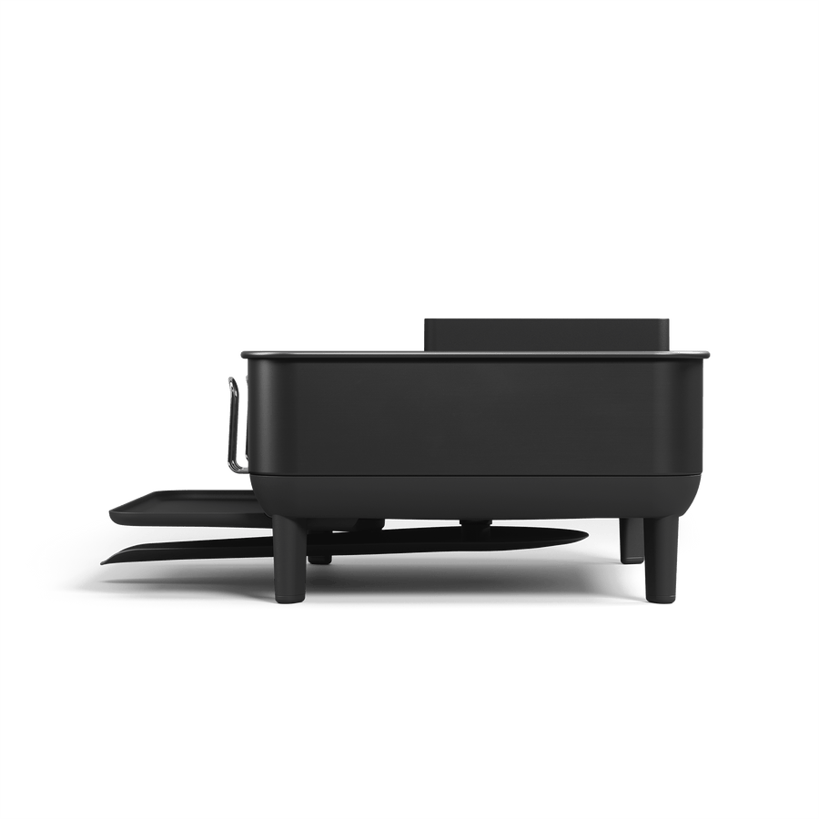 Side view of Simplehuman Compact Steel Frame Dishrack, Matte Black, showing adjustable spout and exterior cup rack.