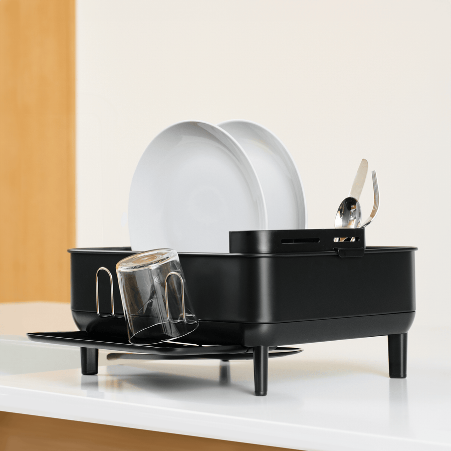 Simplehuman Compact Steel Frame Dishrack, Matte Black, low-angle view showing cup rack and utensil caddy.