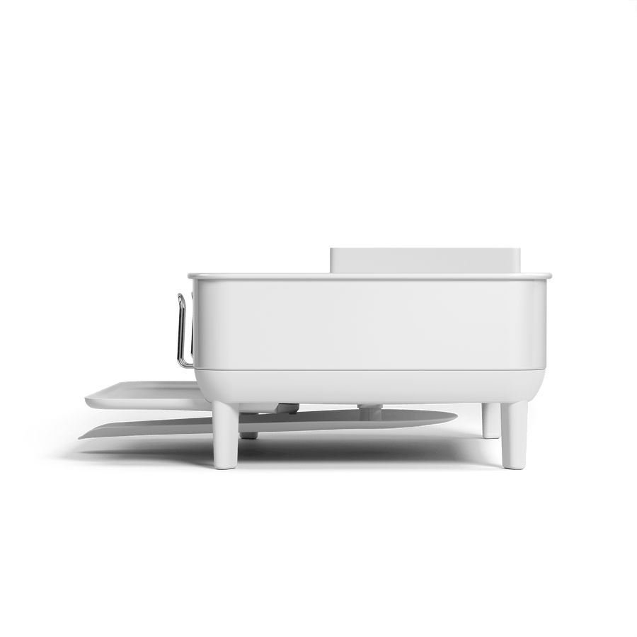 Profile view of Simplehuman Compact Steel Frame Dishrack in White, showing integrated elevated legs and extending drip tray.