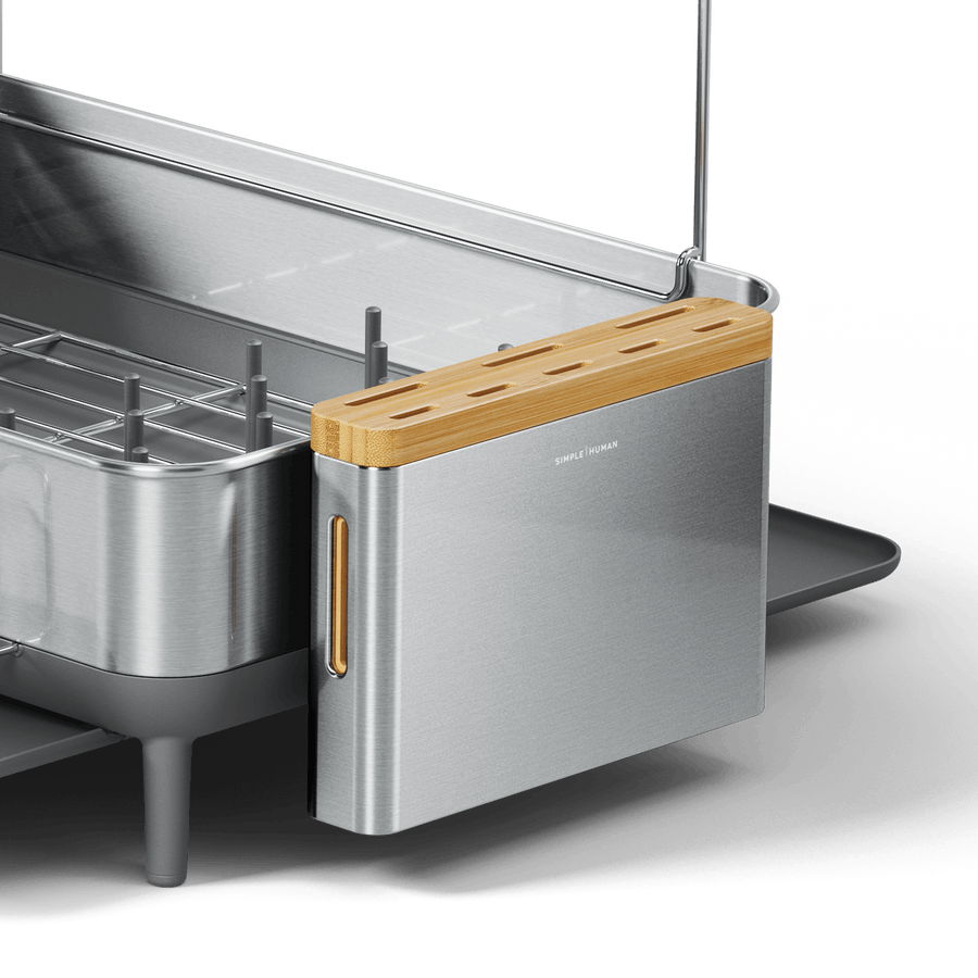 Angled view of Simplehuman Brushed Stainless Steel Knife Block, integrated design with Bamboo top and drip tray window.