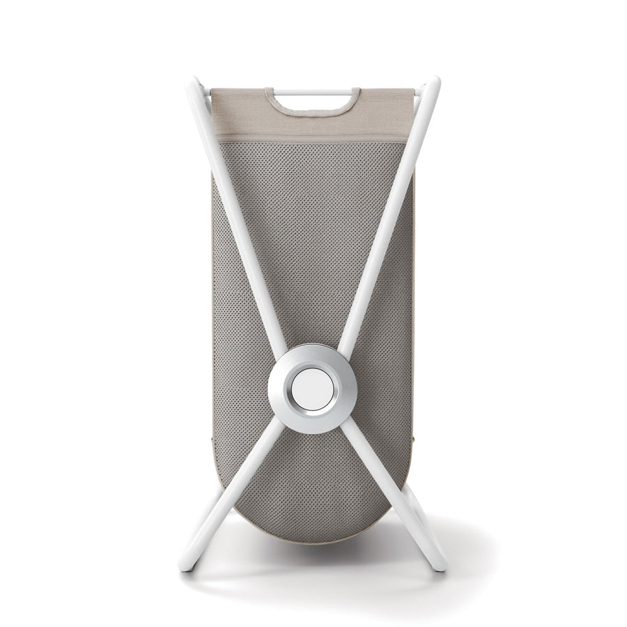 Front view of Simplehuman Single X-Frame Hamper, White frame, removable beige liner with carry handle.