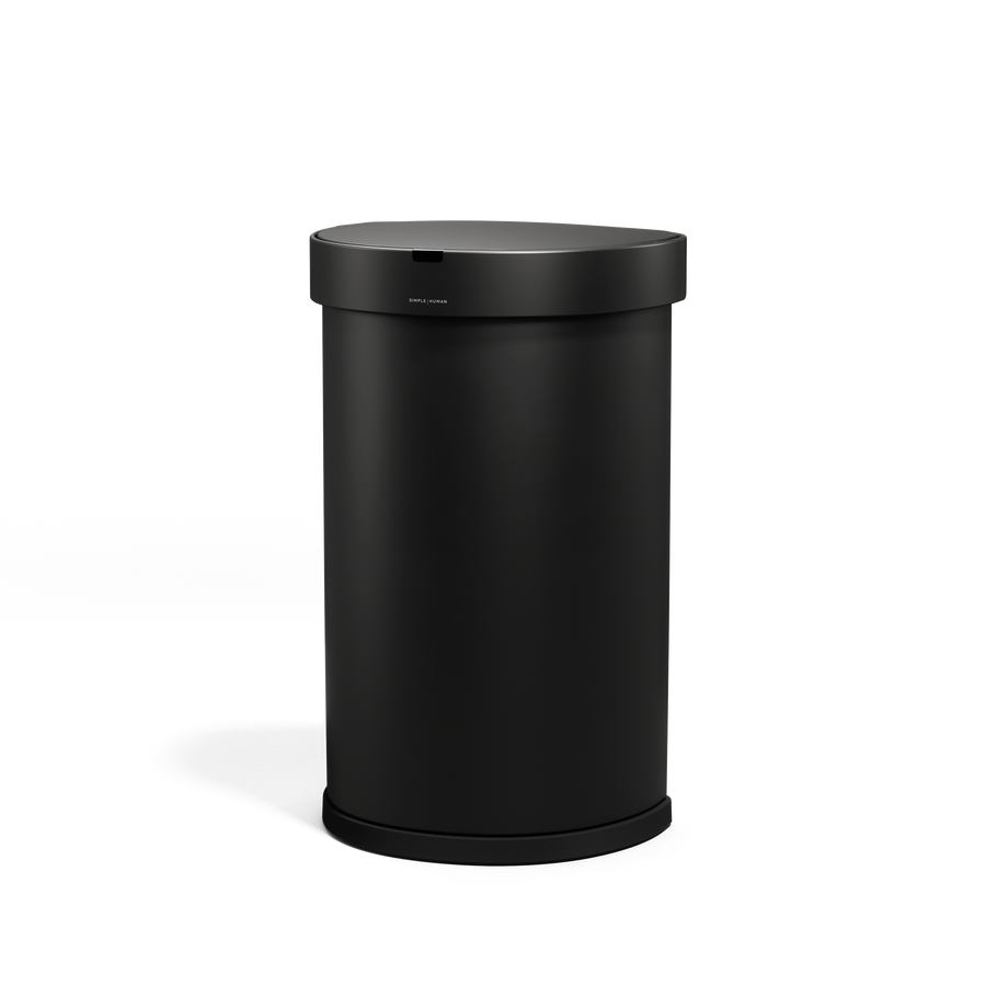 Angled view of Simplehuman 45L Sensor Can, Matte Black, hands-free operation.