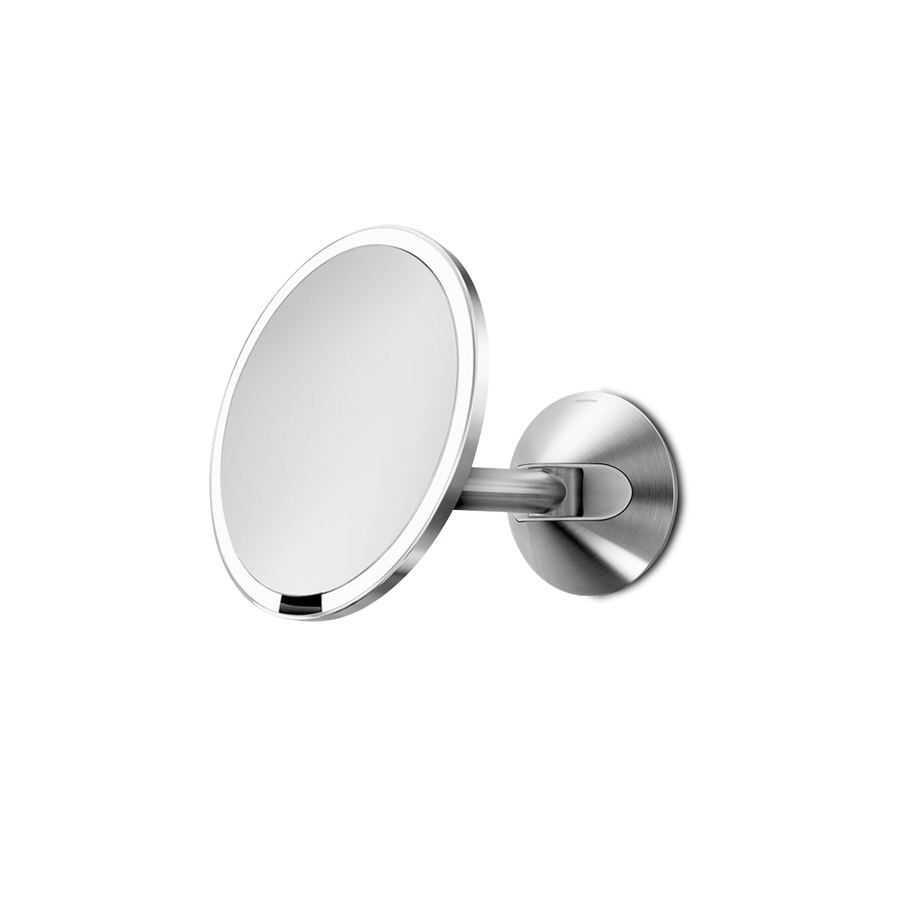 Angled view of Simplehuman Hard-Wired Wall Mount Sensor Mirror, Brushed Stainless Steel, adjustable arm, touch-free.