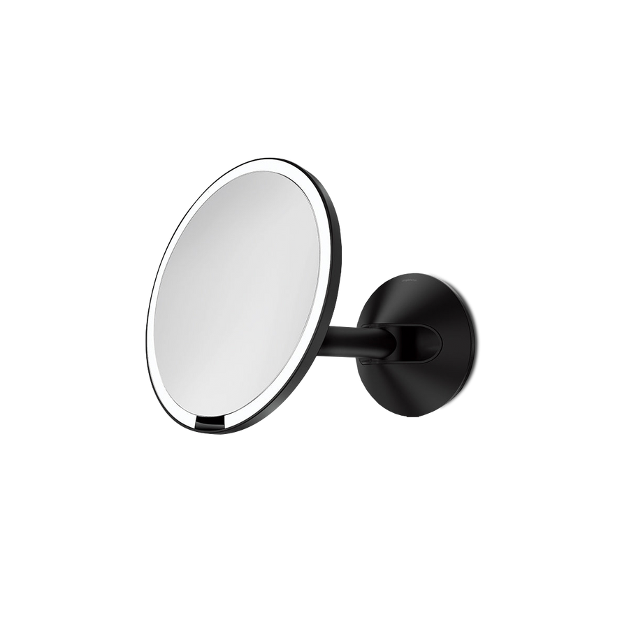 Angled view of Simplehuman Hard-Wired Wall Mount Sensor Mirror in Dark Bronze, adjustable arm, touch-free sensor light.