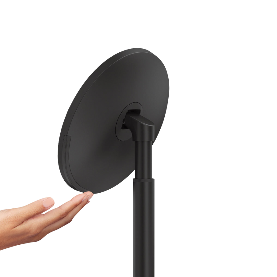 Side profile view, Simplehuman Matte Black Sensor Mirror Round with pivoting tilt and hand gesture sensor.