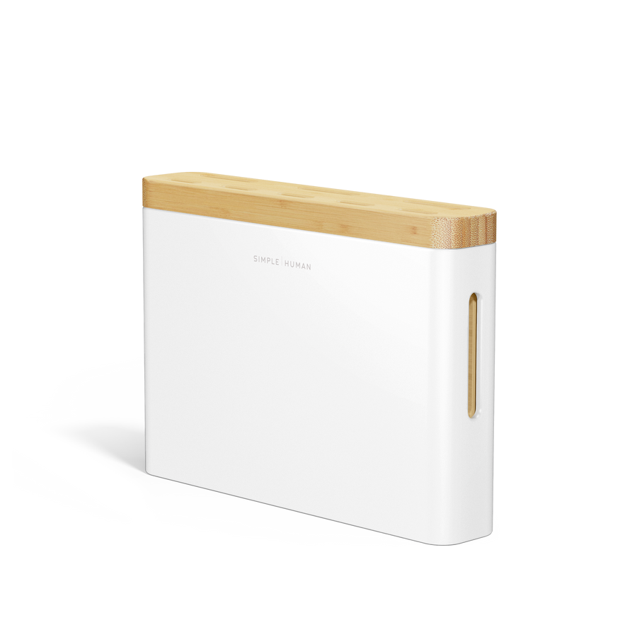 Angled view of Simplehuman White Knife Block with Bamboo top, showing logo and removable drip tray access slot.