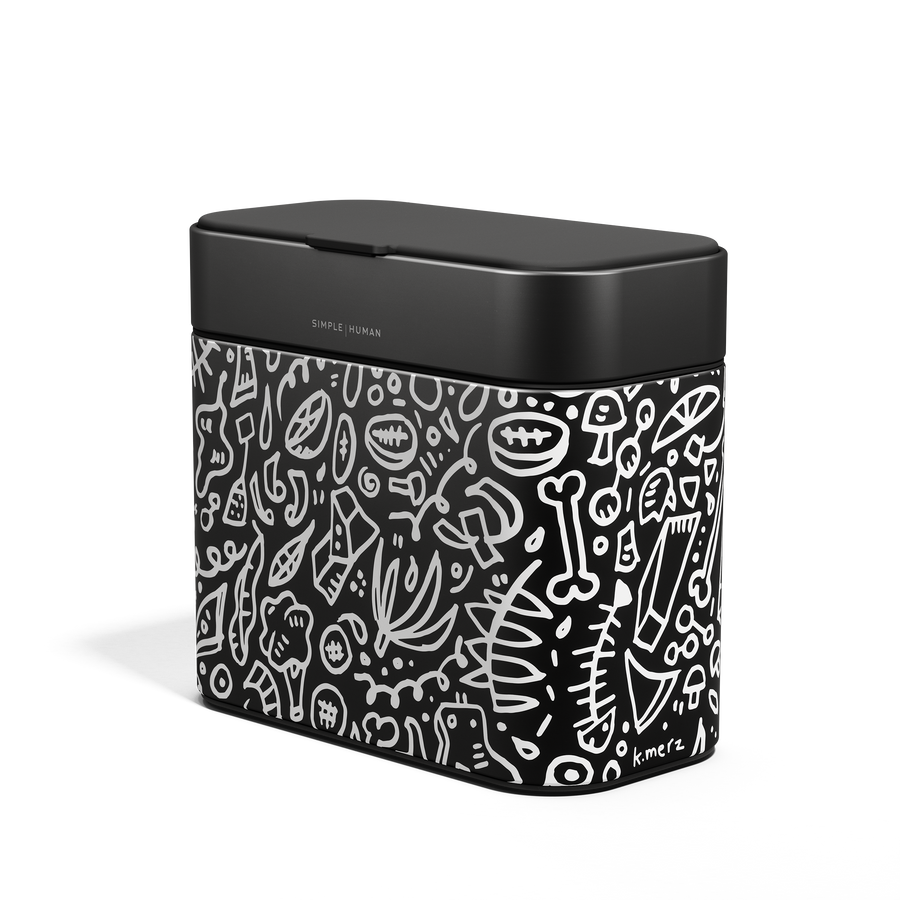 Angled view of Simplehuman Compost Caddy in Matte Black with white doodle pattern, odor-proof countertop use.