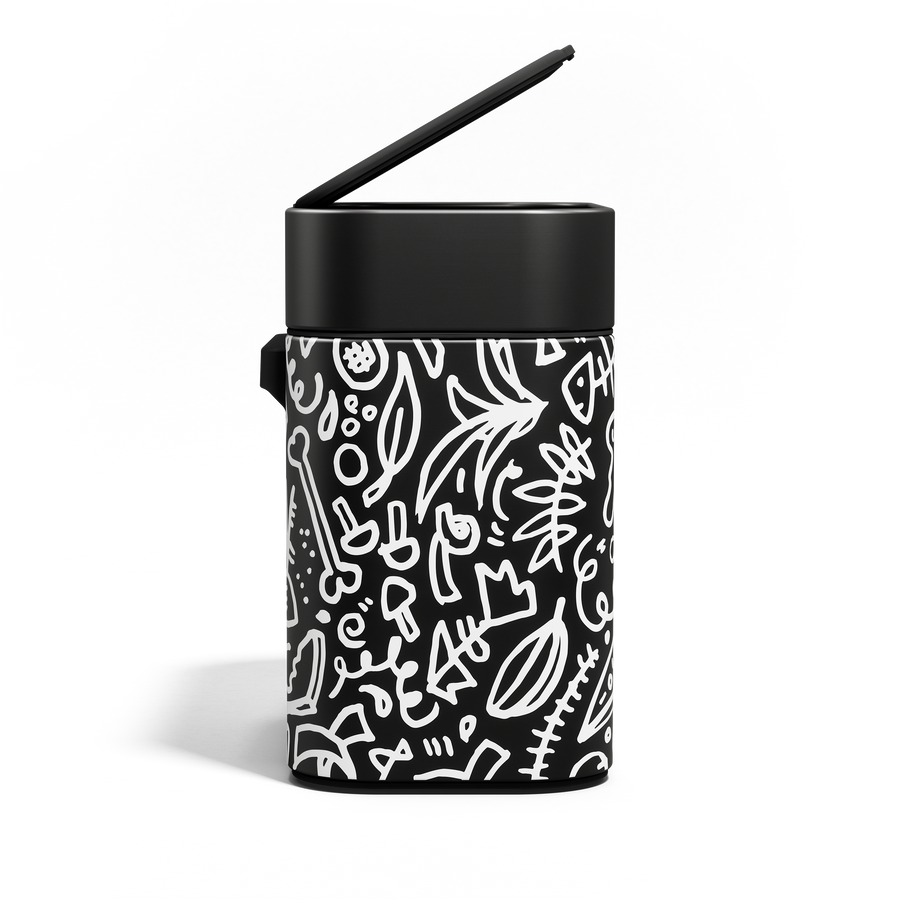 Simplehuman Matte Black Compost Caddy with white doodle pattern, lid raised for quick, odor-proof disposal.