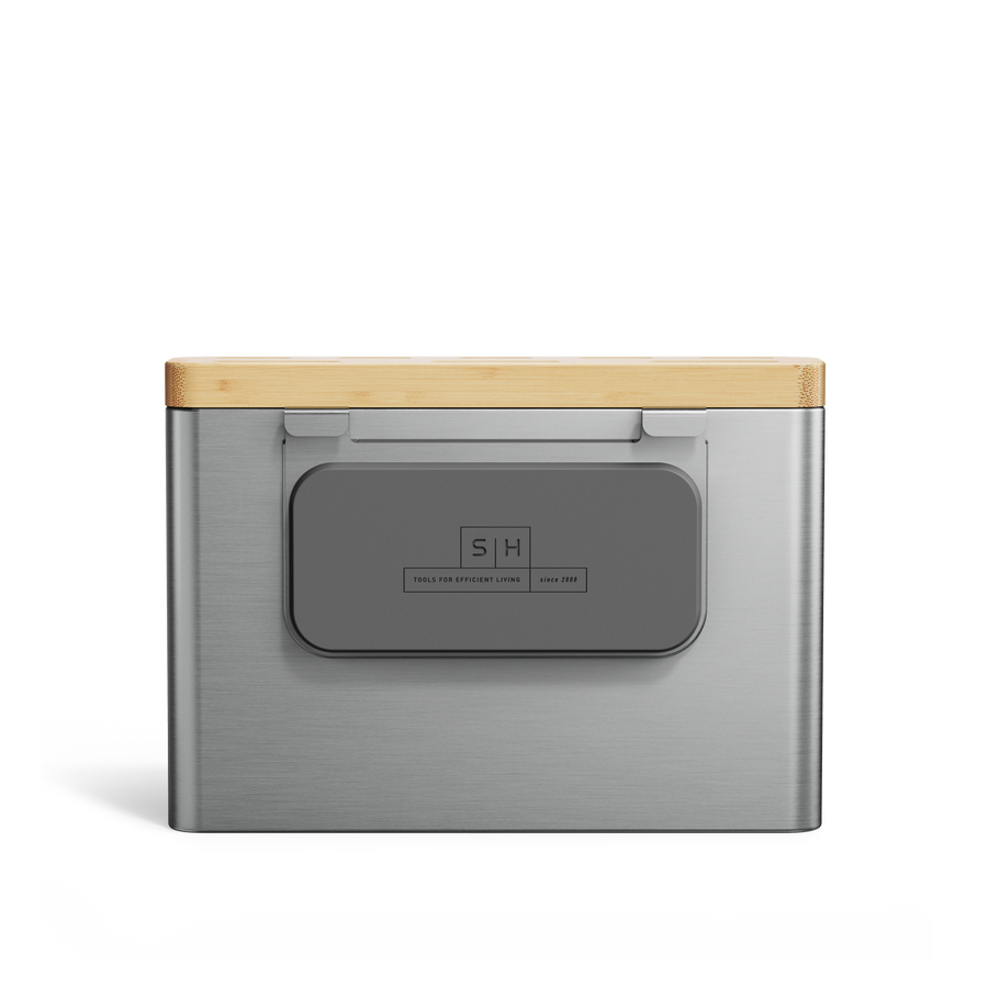 Detail view of Simplehuman Brushed Stainless Steel Knife Block, showing the branded gray front panel and Bamboo top edge.