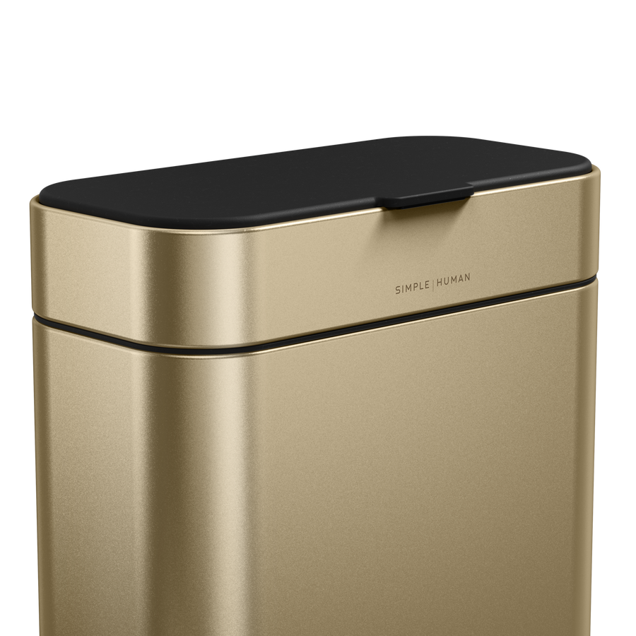 Detail view of Simplehuman Brass Compost Caddy showing the flush lid and branding for an odor-proof seal.