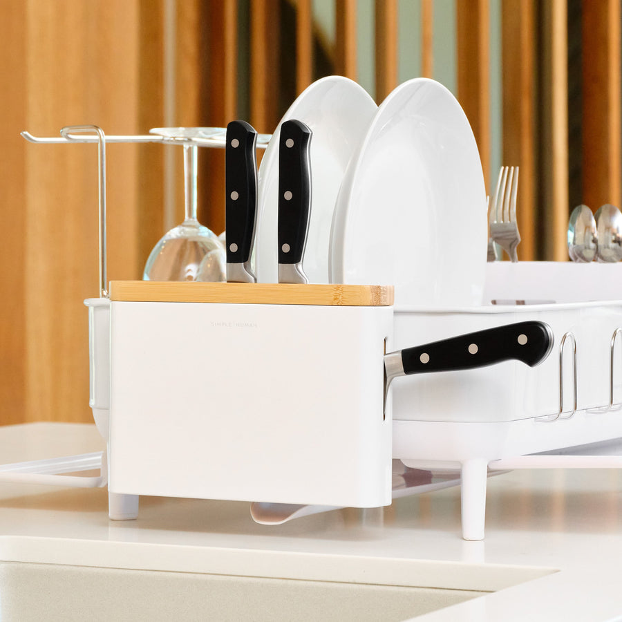 Lifestyle view of Simplehuman White Knife Block with Bamboo top, integrated with dish rack and removable utensil caddy attachment.
