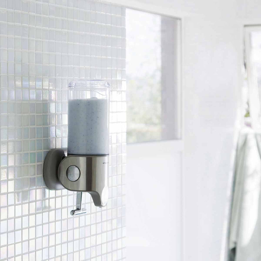 single wall mount pump - lifestyle in shower