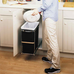 30L under counter pull-out can - lifestyle man scraping plate