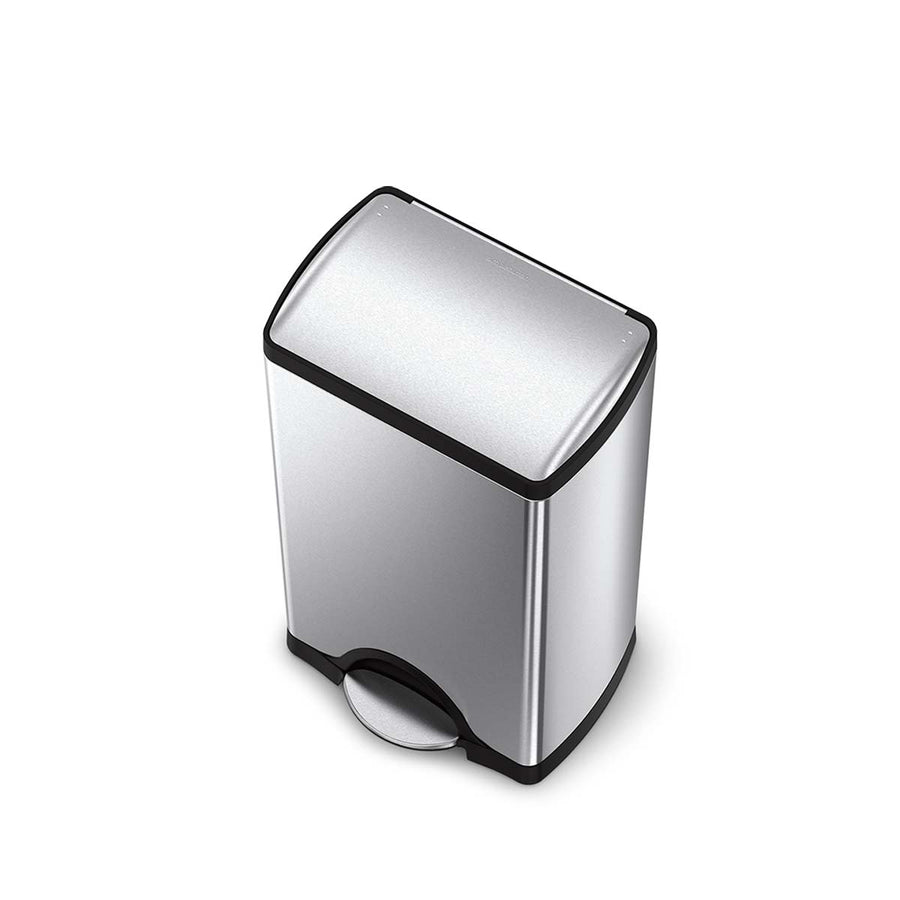 Angled view of Simplehuman 38L Rectangular Step Can in Brushed Stainless Steel, featuring hands-free foot pedal.