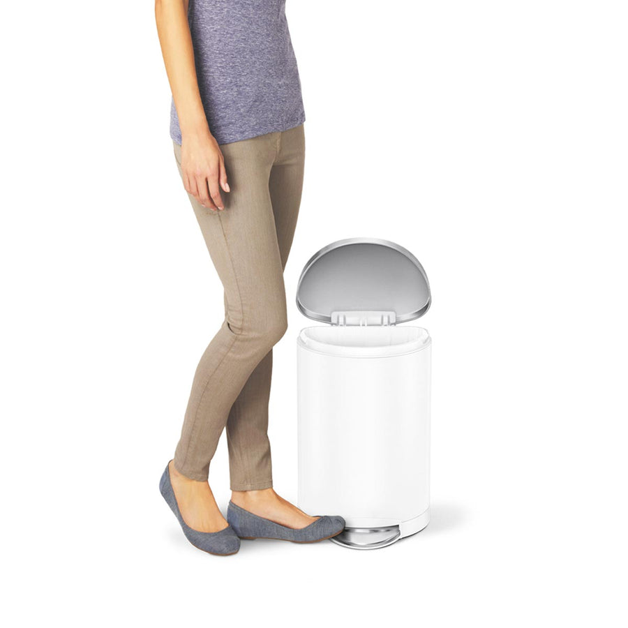 Usage view of Simplehuman 10L Step Can, White, showing hands-free foot pedal operation.