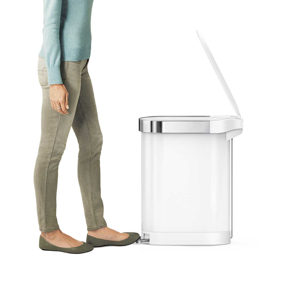 Simplehuman White 45L Slim Step Can, demonstrating hands-free foot pedal use and polished liner rim.
