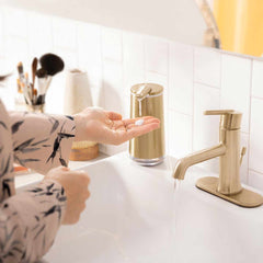 foam sensor pump - brass finish - hand using pump in bathroom